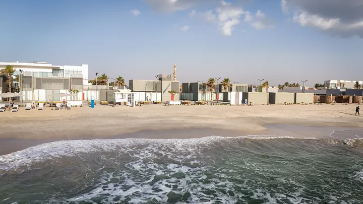 View photo: Al Bahr’s beachfront from the water’s edge.