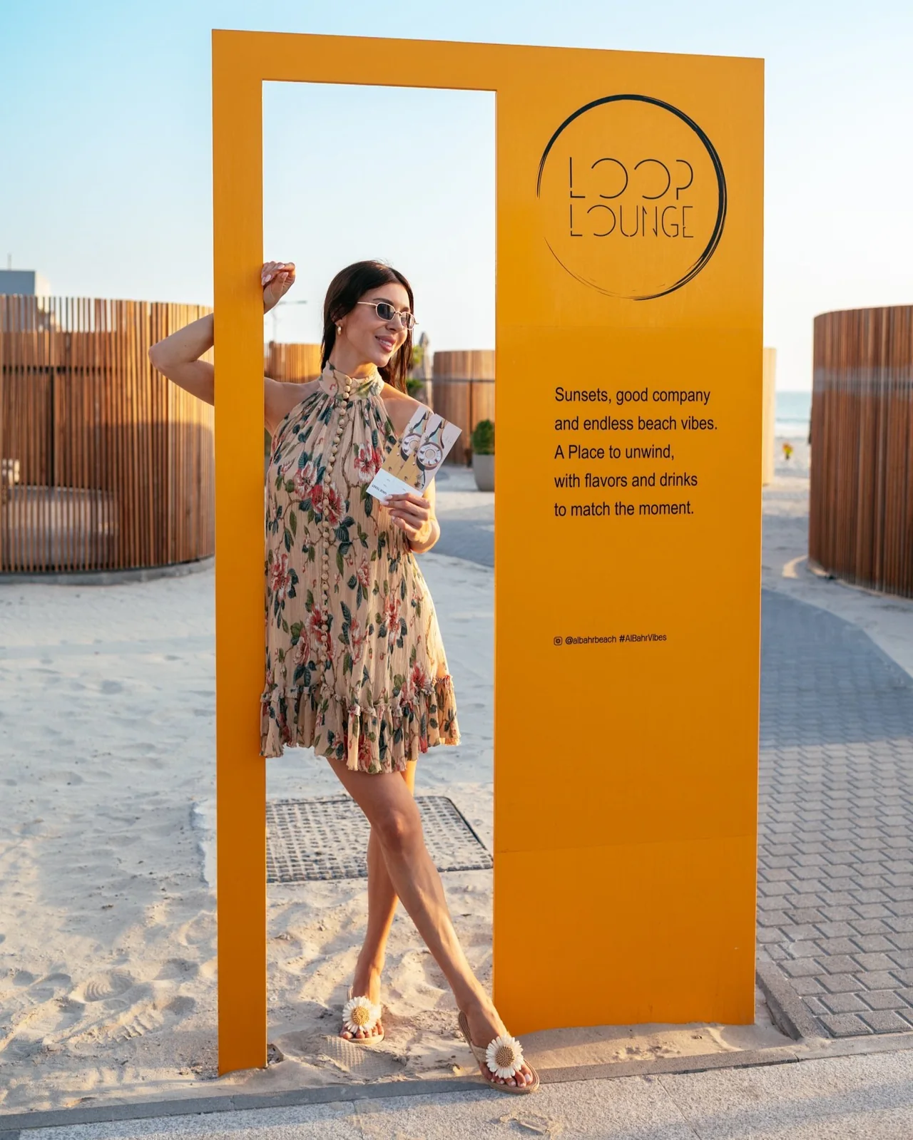 The yellow Loop Lounge entrance, with its Loop sign and a visitor at the doorway.